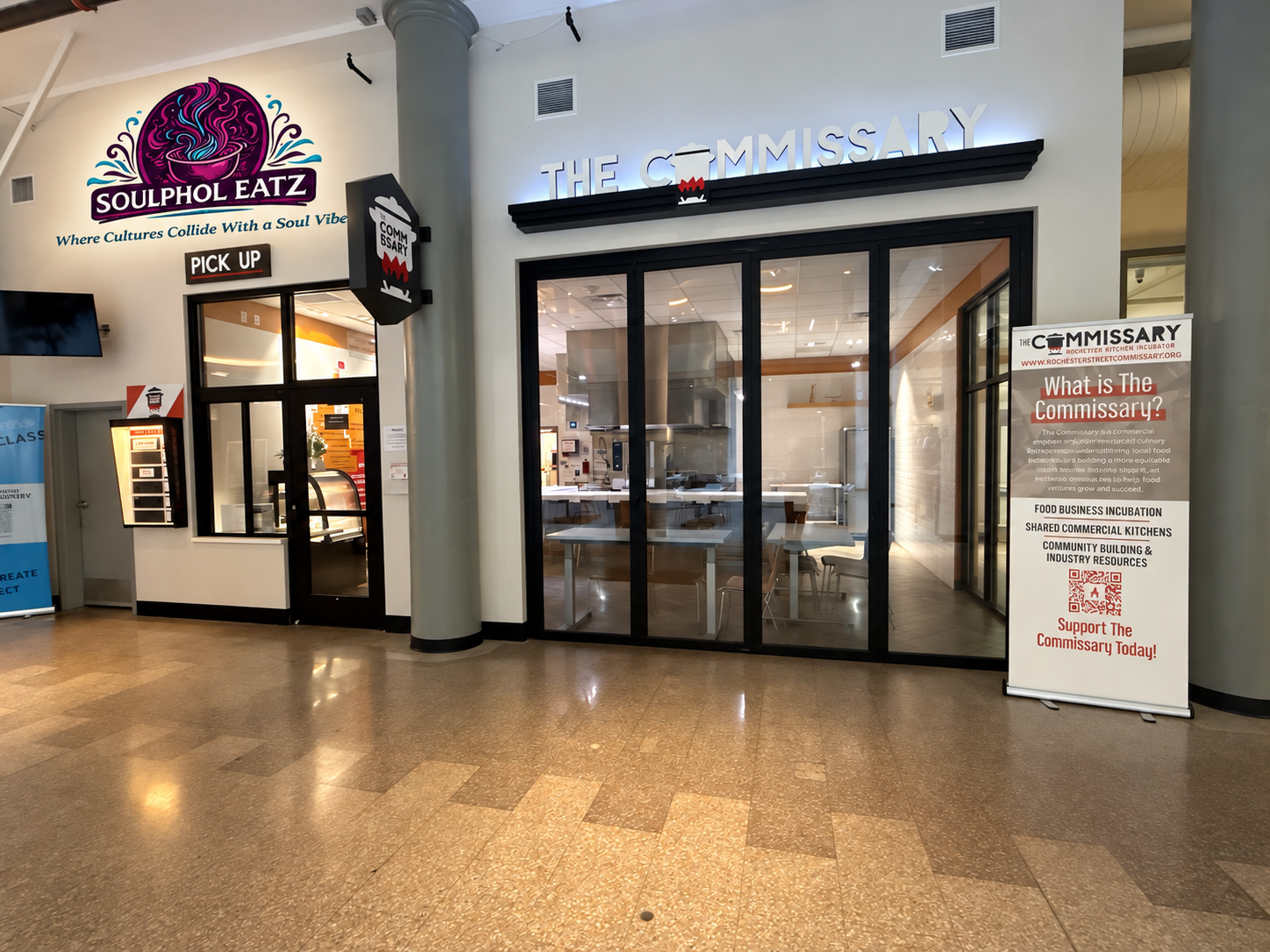 The Commissary pickup window inside Mercantile on Main with promotional Soulphol Eatz branding